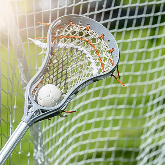 Lacrosse stick that has a ball in it