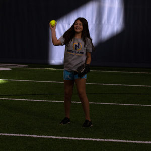 Girl holding a softball