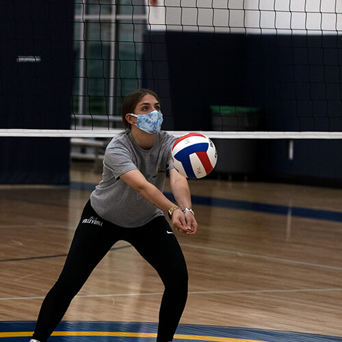 Girl hitting volleyball