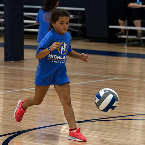 Girl running to get the volleyball