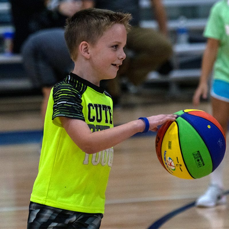 Boy dibbling the basketball