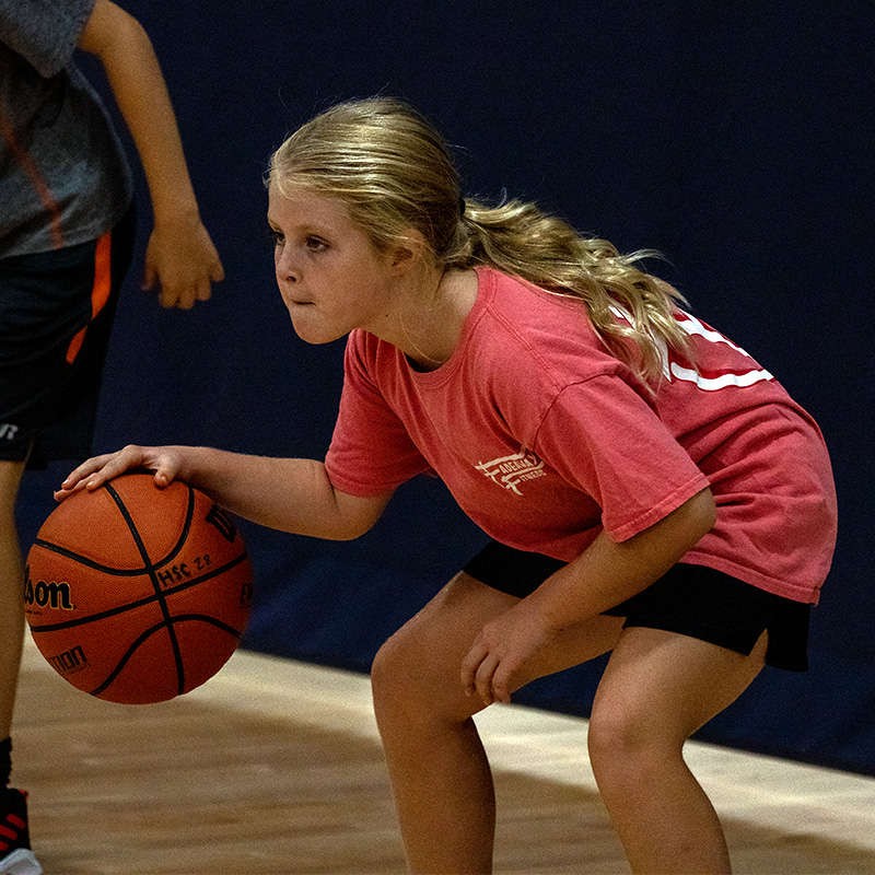 Girl dibbling the basketball