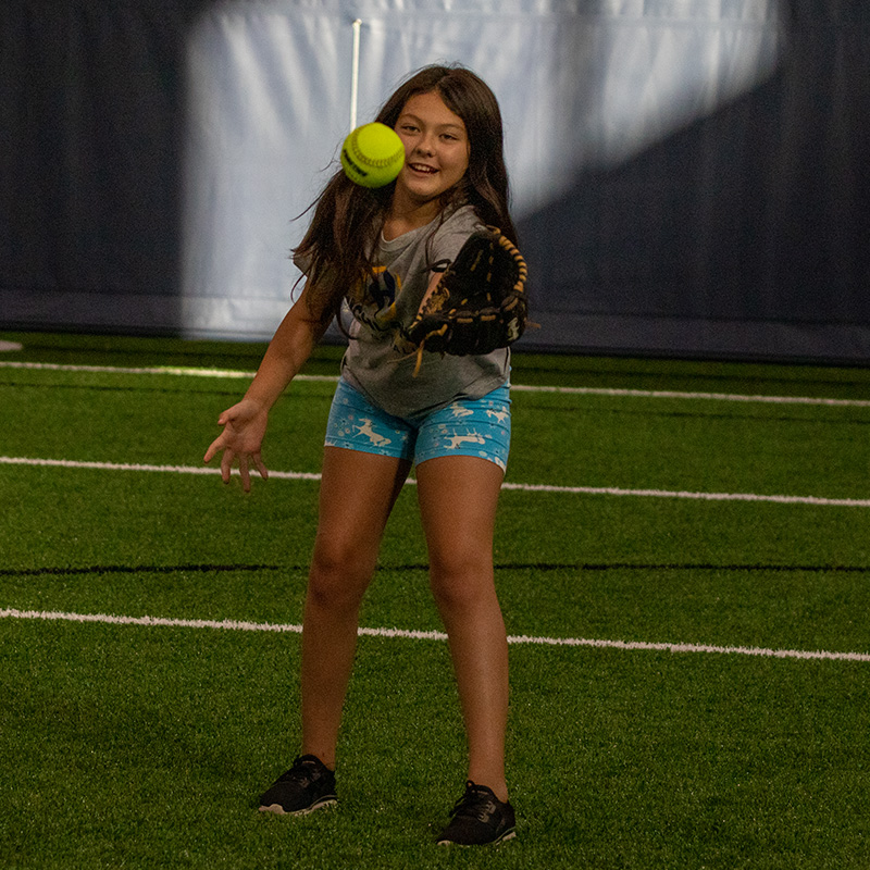 Person wearing a glove ready to catch the ball